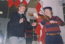 Steve Brown plays the bones while Ryan Thomson fiddles.